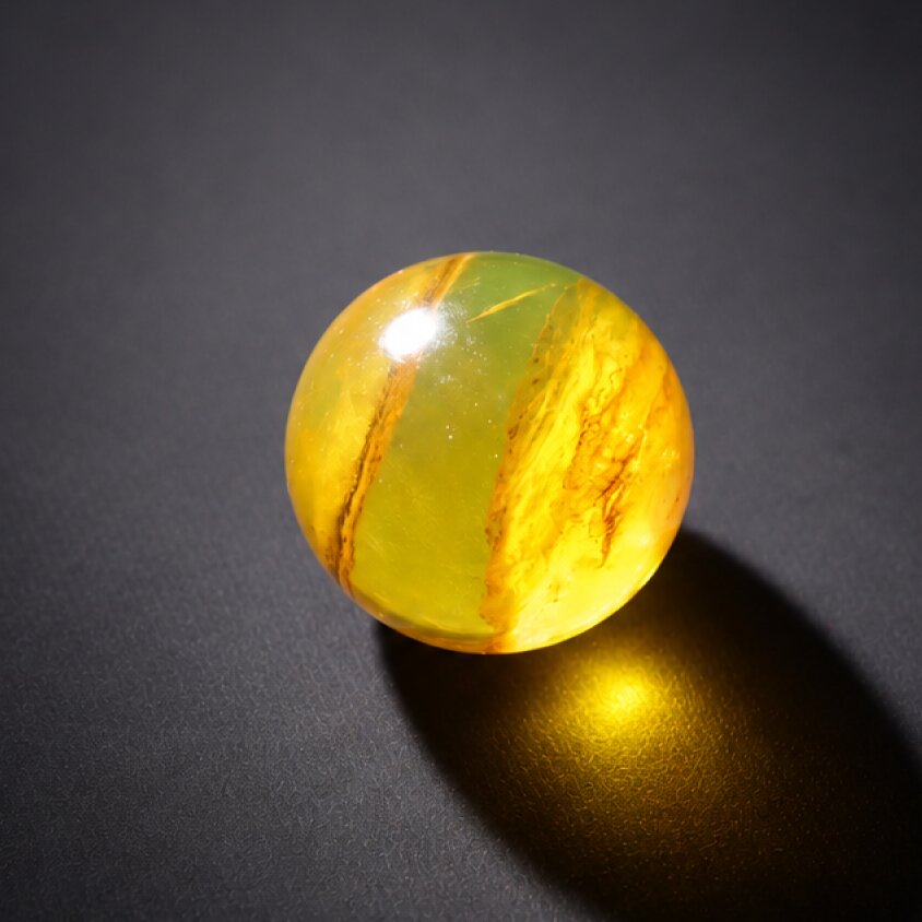 Pure natural orange green Dominican amber sphere/ball 20.5mm