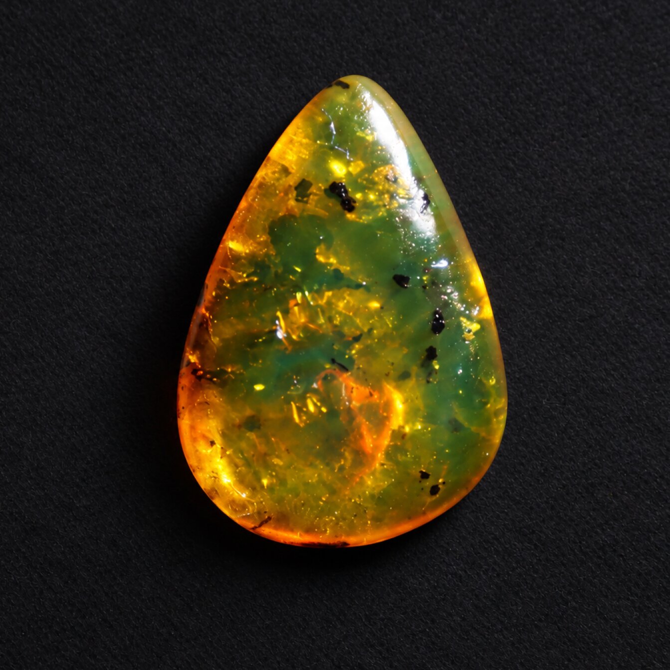 Untreated green orange polished Dominican amber 1.2g