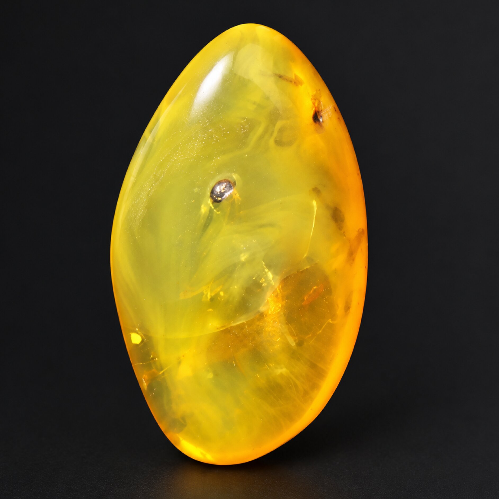 Natural orange yellow polished Dominican amber