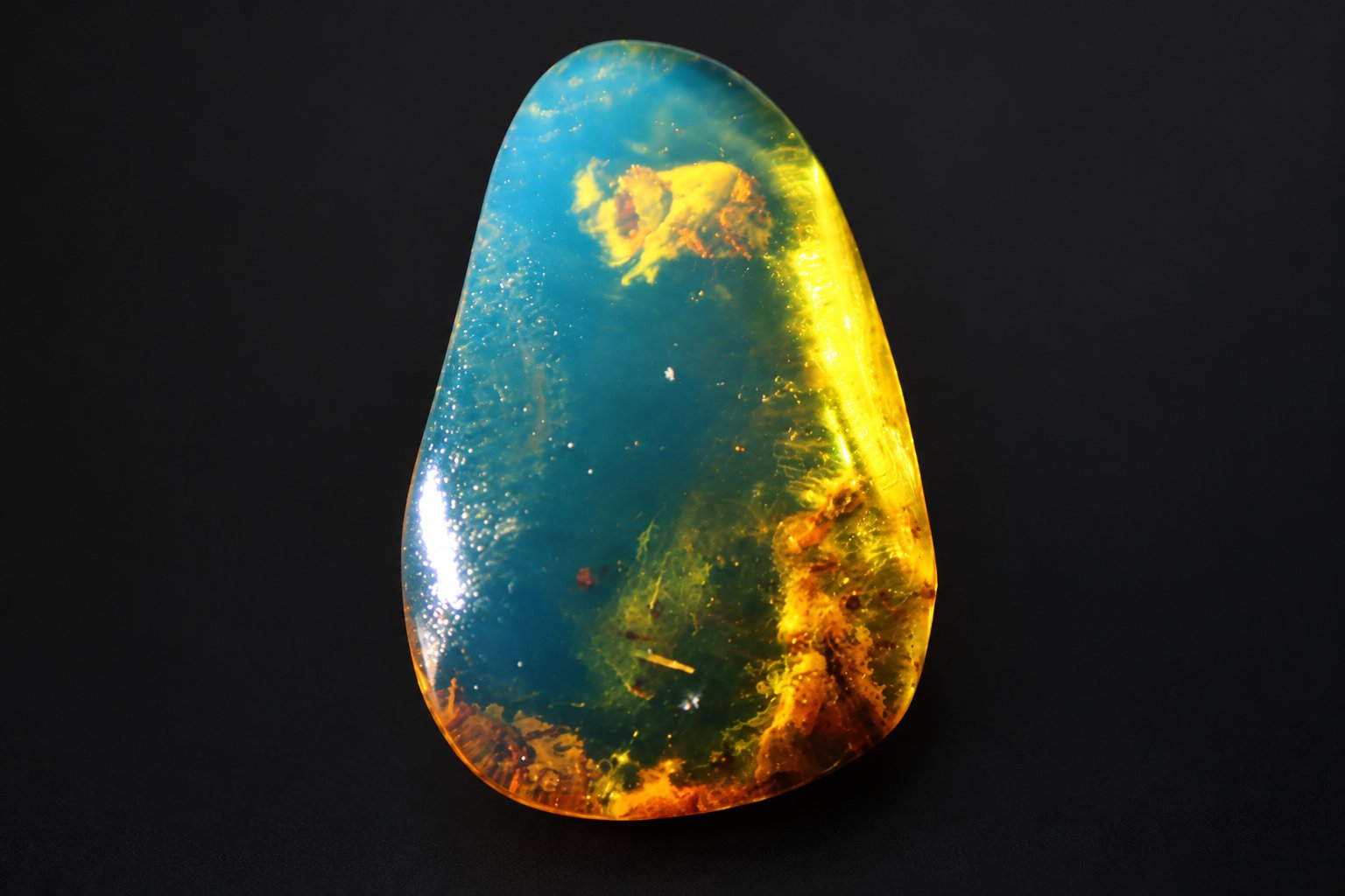 Earth crafted deep blue Dominican amber cabochon – photo 2